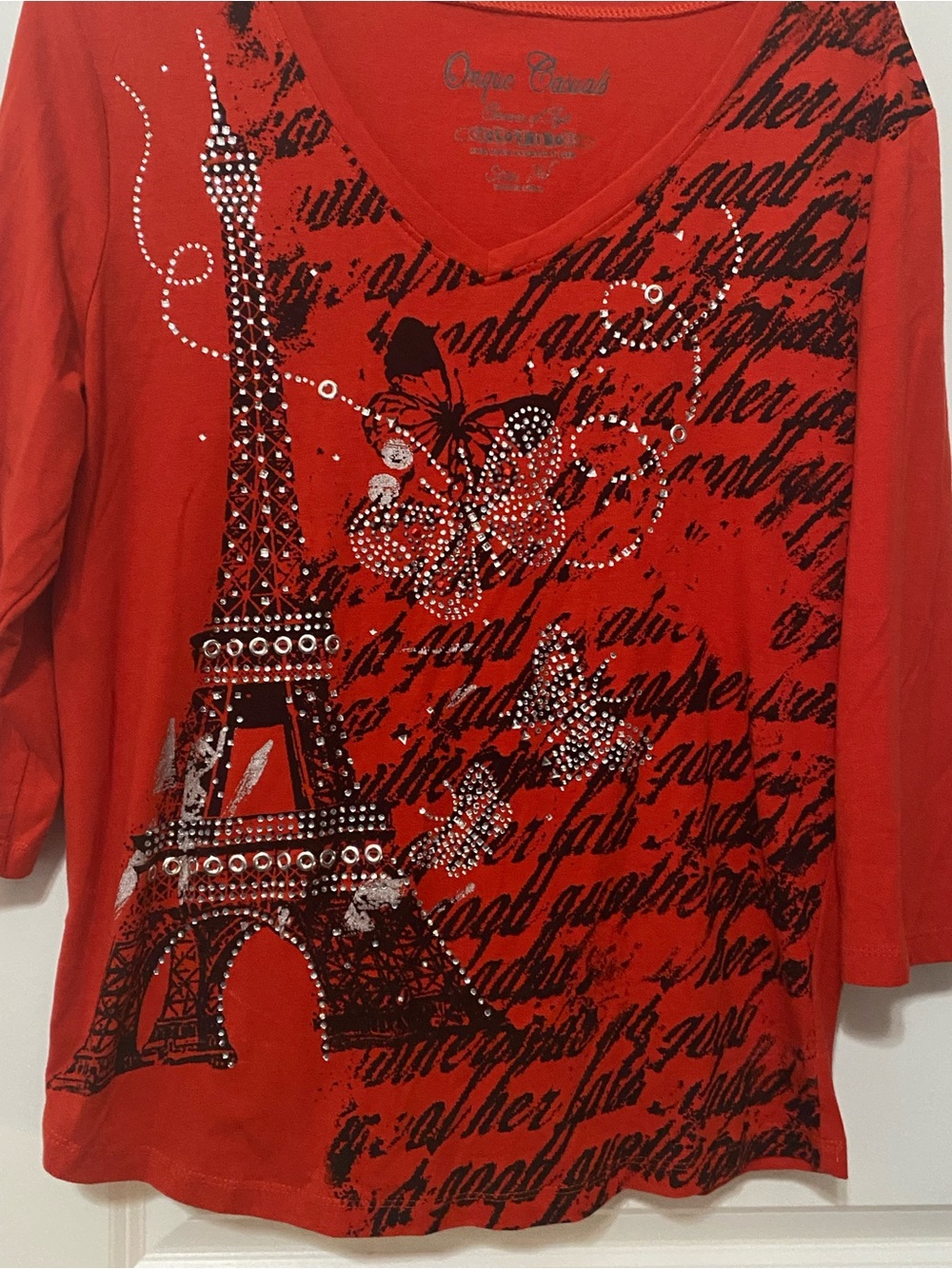 Onque Casuals Red Eiffel Tower V-Neck Top with Rhinestone Detail